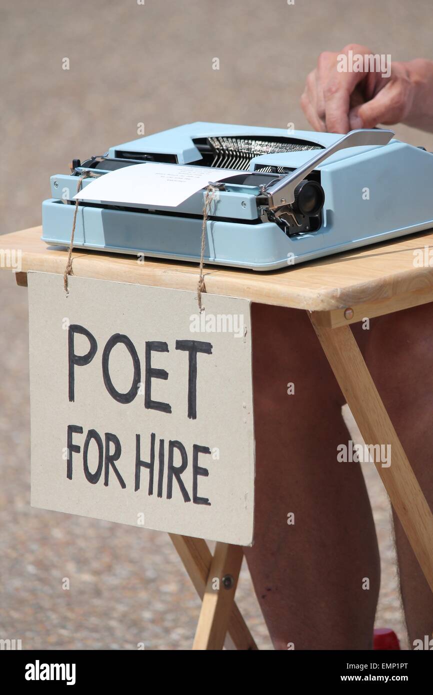 Poet for hire with typewriter rent writer Stock Photo Alamy