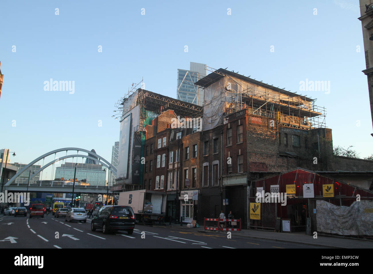 London, UK. 21 April 2015. New and the old. Top of the Broadgate Tower seen from Commercial Street.  Credit: David Mbiyu/ Alamy Stock Photo