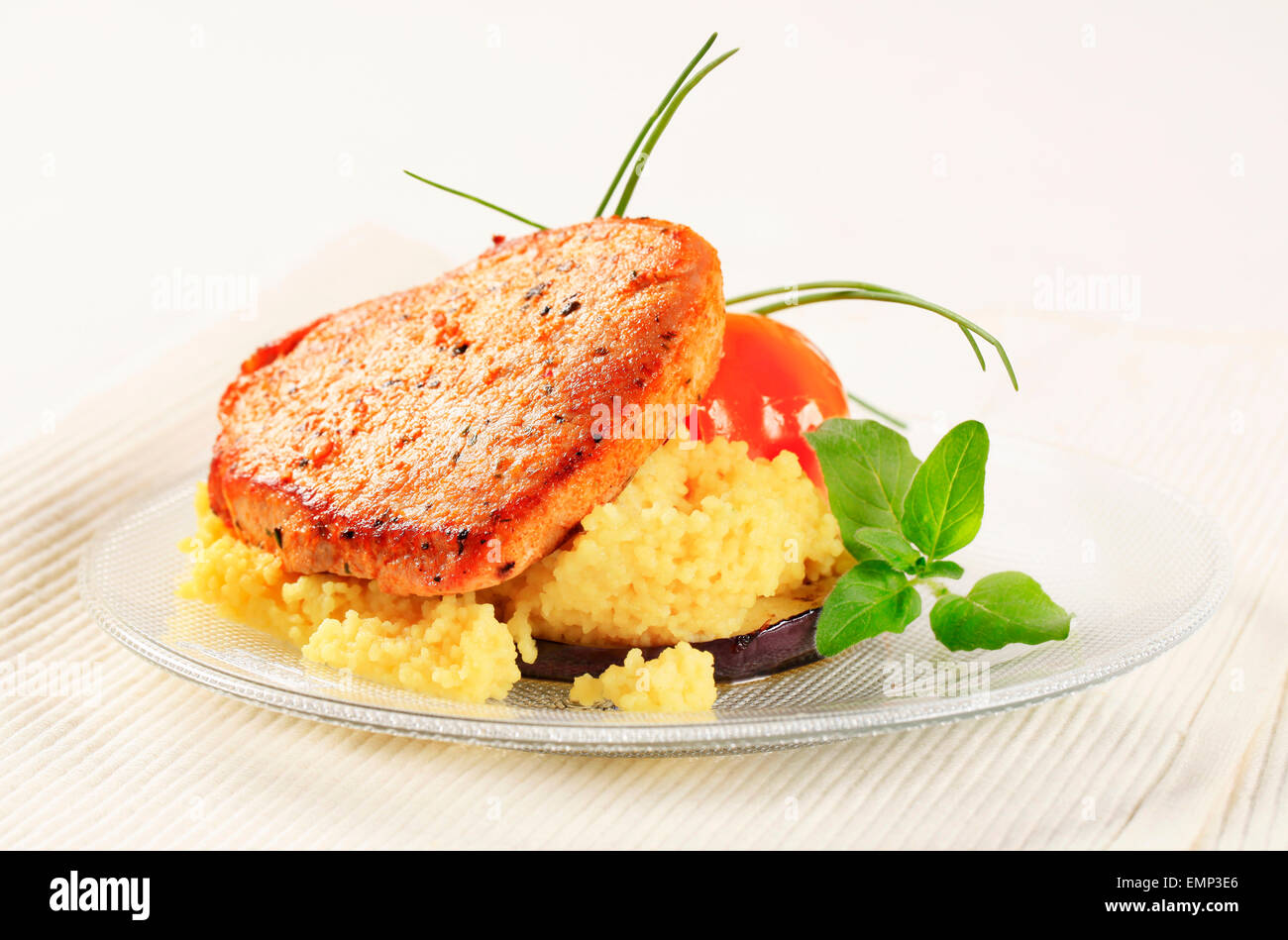 Marinated pork served with couscous Stock Photo Alamy