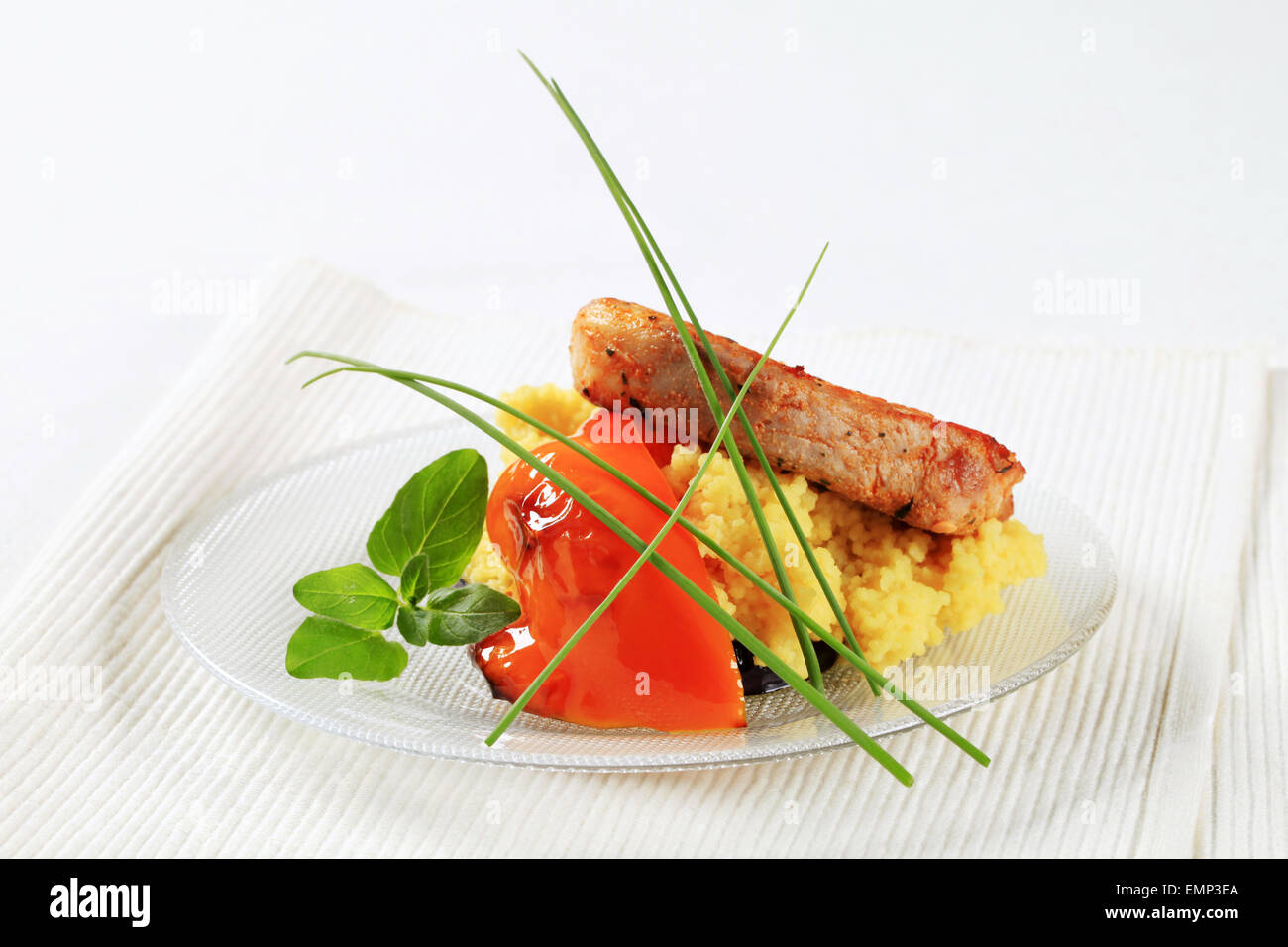 Marinated pork served with couscous Stock Photo