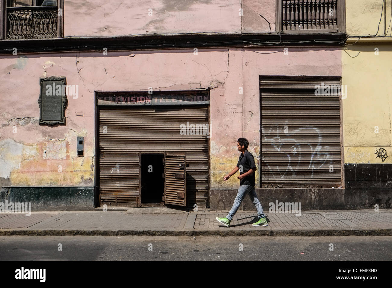 A man walking in front of old building at the old town Lima, Peru Stock Photo