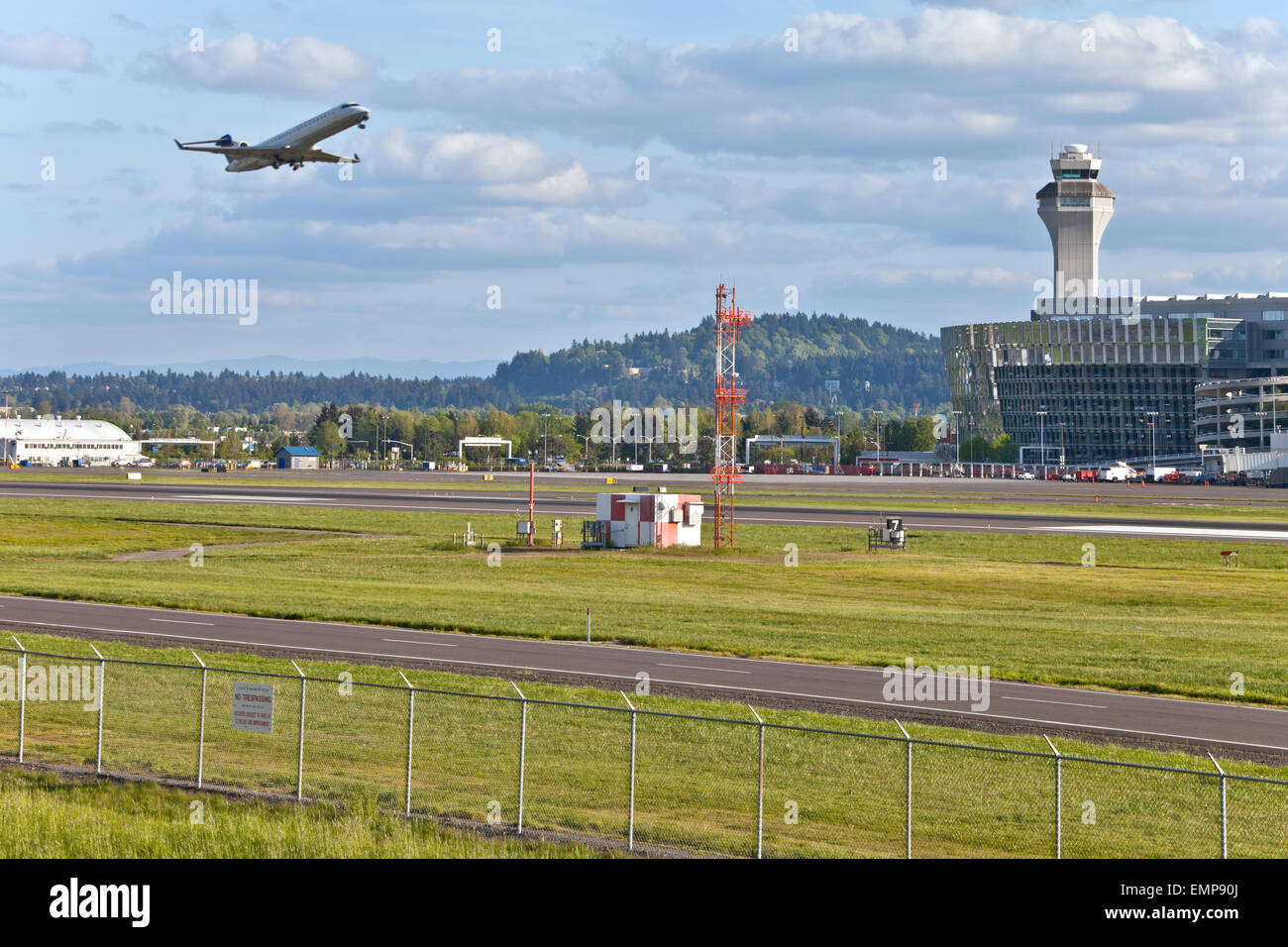 Portland Oregon airport ailine gates and aircrafts flying. Stock Photo