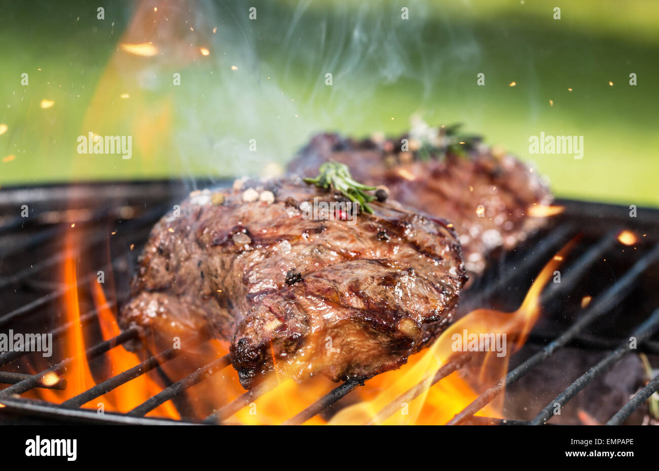 Beef steaks on grill Stock Photo Alamy