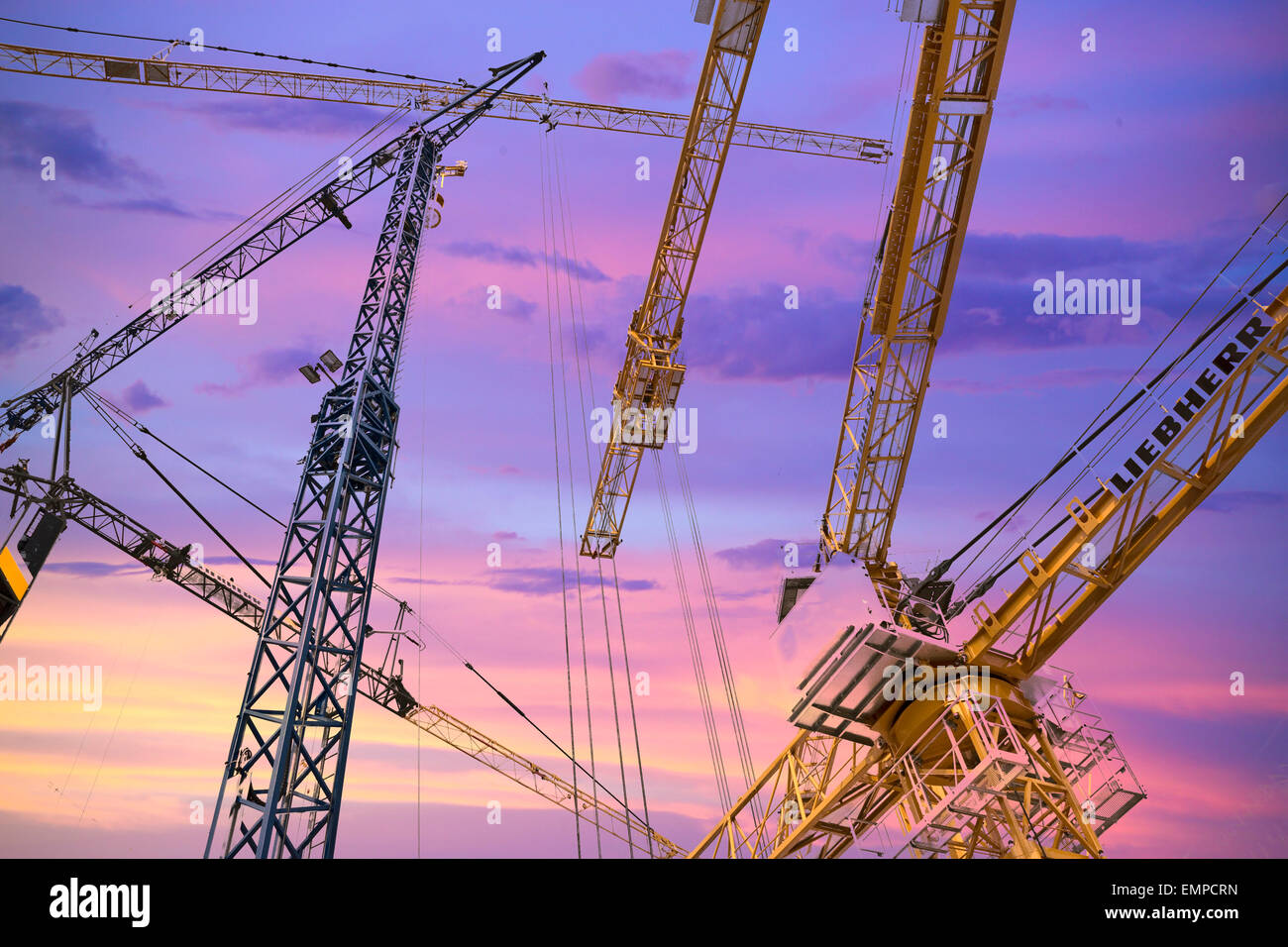 Cranes at Bauma 2013 in evening light, international trade fair for construction machinery, Munich, Bavaria, Germany Stock Photo