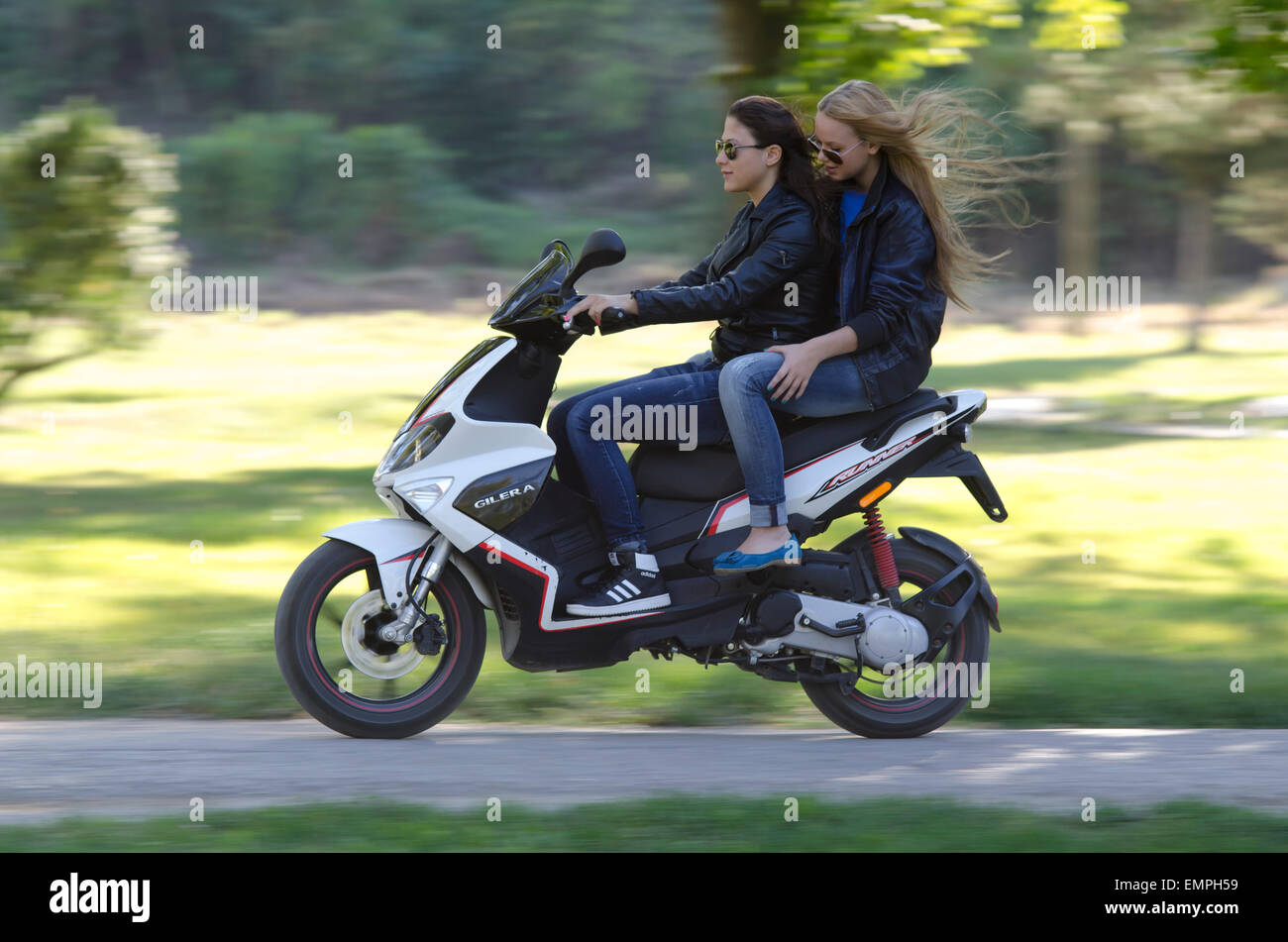 Girls driving scooter hires stock photography and images Alamy
