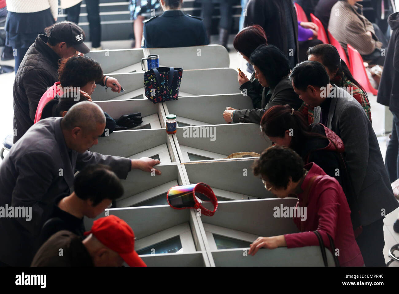 Nantong, China's Jiangsu Province. 23rd Apr, 2015. Investors are seen at a stock trading hall in Nantong, east China's Jiangsu Province, April 23, 2015. Chinese shares ended mixed on Thursday, with the benchmark Shanghai Composite Index up 0.36 percent, or 16.01 points, to finish at 4,414.51 points. The Shenzhen Component Index lost 0.04 percent, or 5.92 points, to close at 14,743.22 points. Credit:  Xu Congjun/Xinhua/Alamy Live News Stock Photo