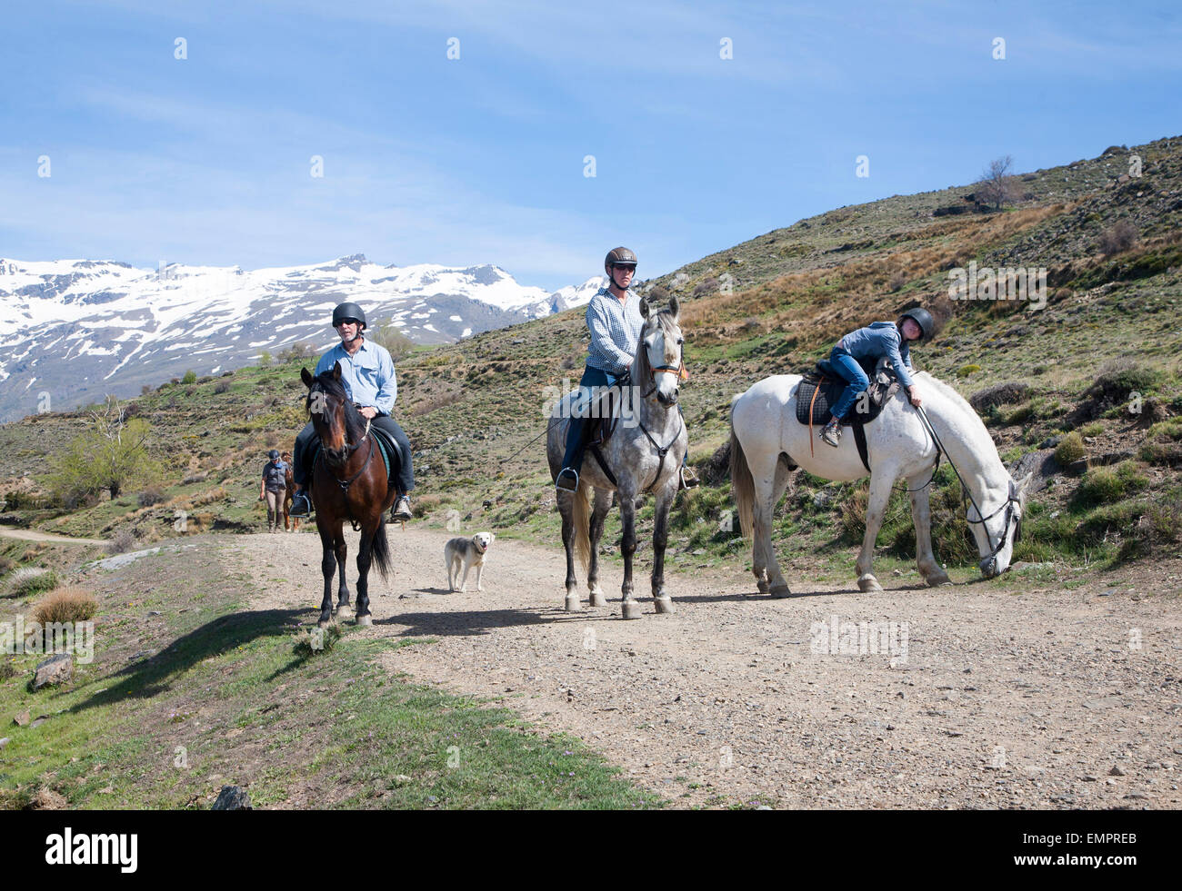 People horse riding in Sierra Nevada Mountains, High Alpujarras, Granada Province, Spain Stock Photo