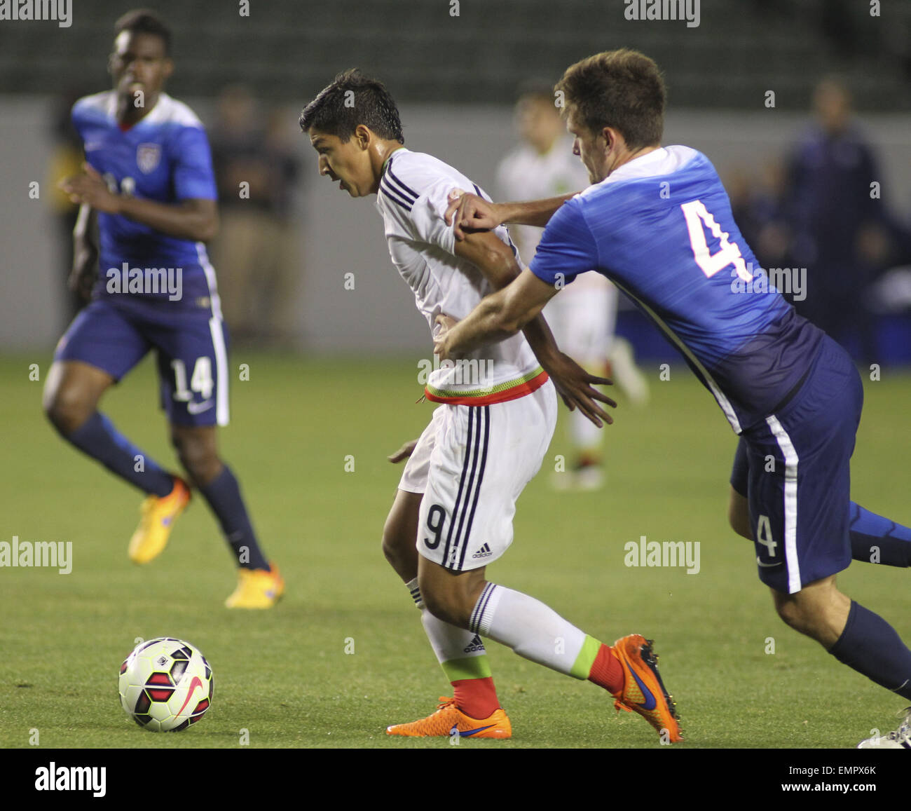 Los Angeles, California, USA. 22nd Apr, 2015. United States' Shane O'Neill #4 actions against Mexico's çngel Zaldivar #9 during a men's national team international friendly match, April 22, 2015, at StubHub Center in Carson, California. United States won 3-0. Credit:  Ringo Chiu/ZUMA Wire/Alamy Live News Stock Photo