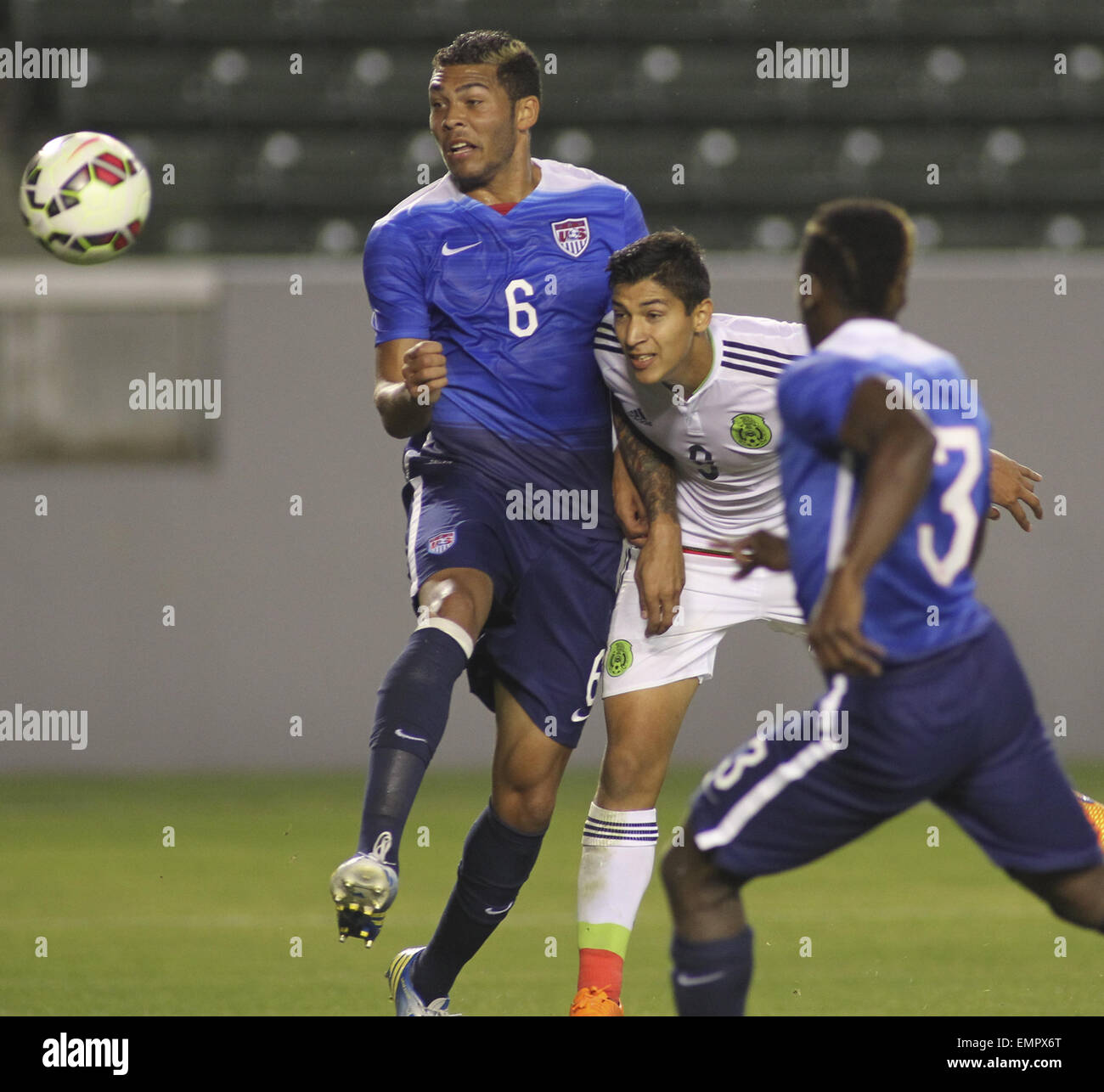 Los Angeles, California, USA. 22nd Apr, 2015. United States' Christian Dean #6 actions against Mexico's çngel Zaldivar #9 during a men's national team international friendly match, April 22, 2015, at StubHub Center in Carson, California. United States won 3-0. Credit:  Ringo Chiu/ZUMA Wire/Alamy Live News Stock Photo