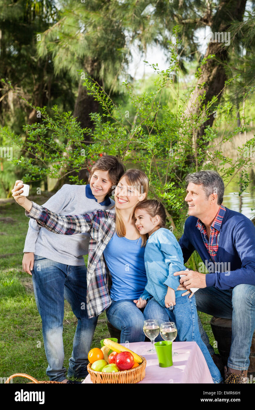 Family Taking Selfportrait At Campsite Stock Photo