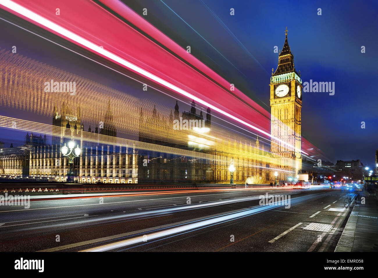 Big Ben, one of the most prominent symbols of both London and England, as shown at night along with the lights of the cars passi Stock Photo