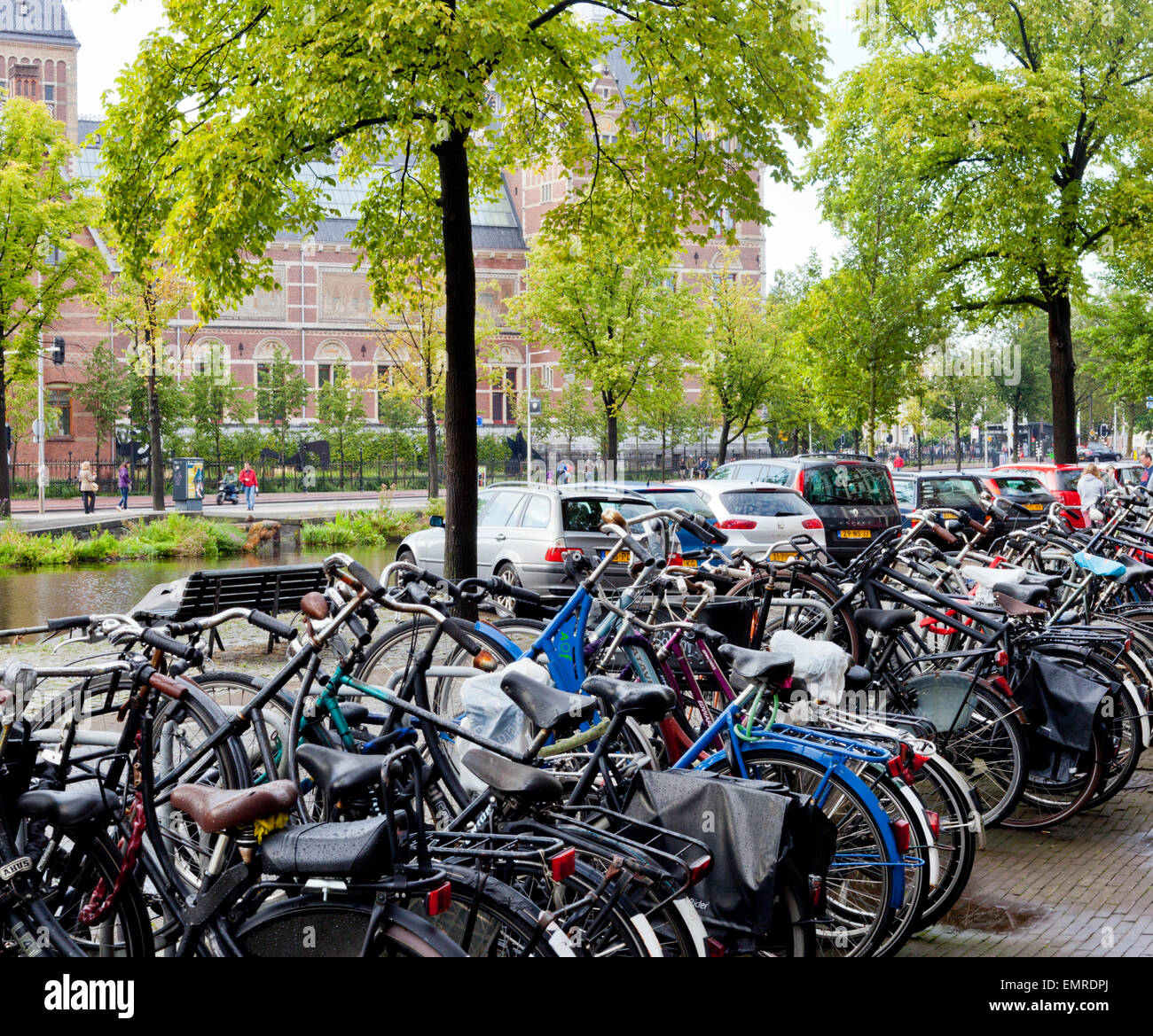 Bikes parked by the canal in Amsterdam Holland Stock Photo Alamy