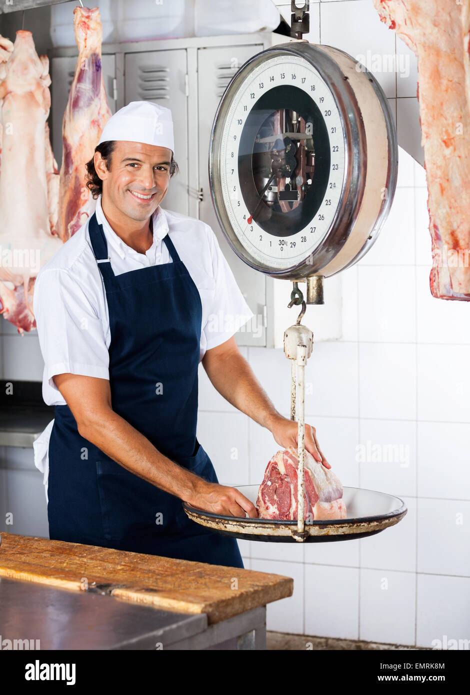 Butcher weighing meat on scale hi-res stock photography and images - Alamy