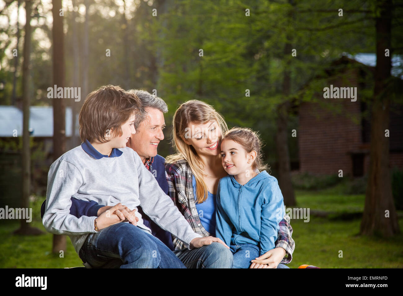 Family Spending Quality Time At Campsite Stock Photo