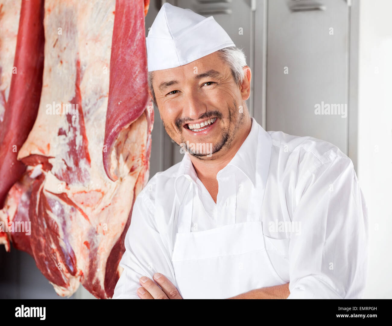 Confident Butcher Smiling In Slaughterhouse Stock Photo - Alamy