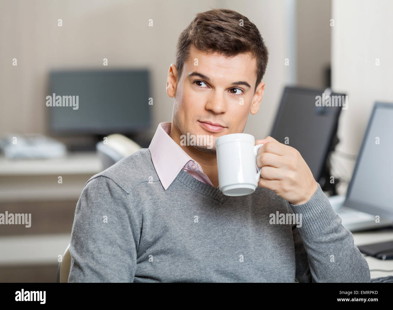 Employee Having Coffee In Call Center Stock Photo