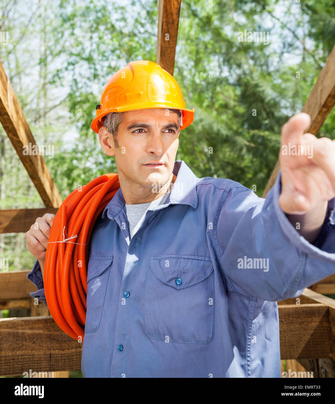 Construction Worker Pointing At Site Stock Photo Alamy