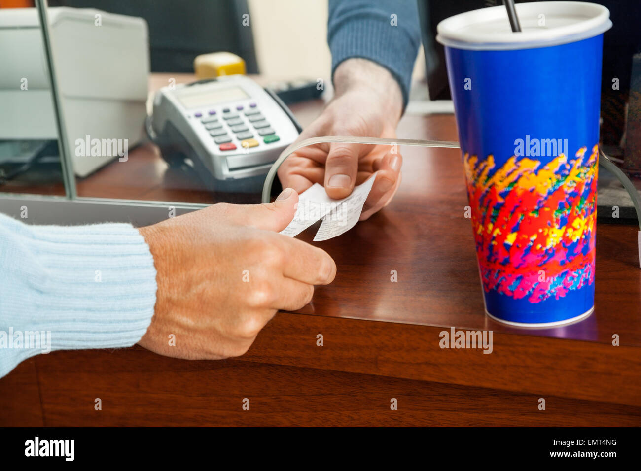 Women Buying Movie Tickets At Box Office Stock Photo