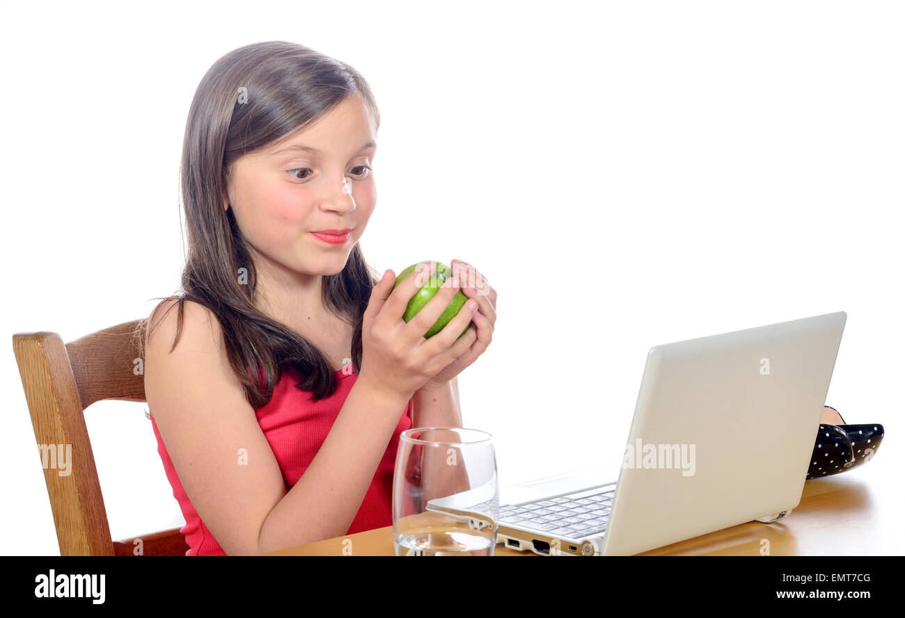 a little girl at her desk with an apple Stock Photo - Alamy