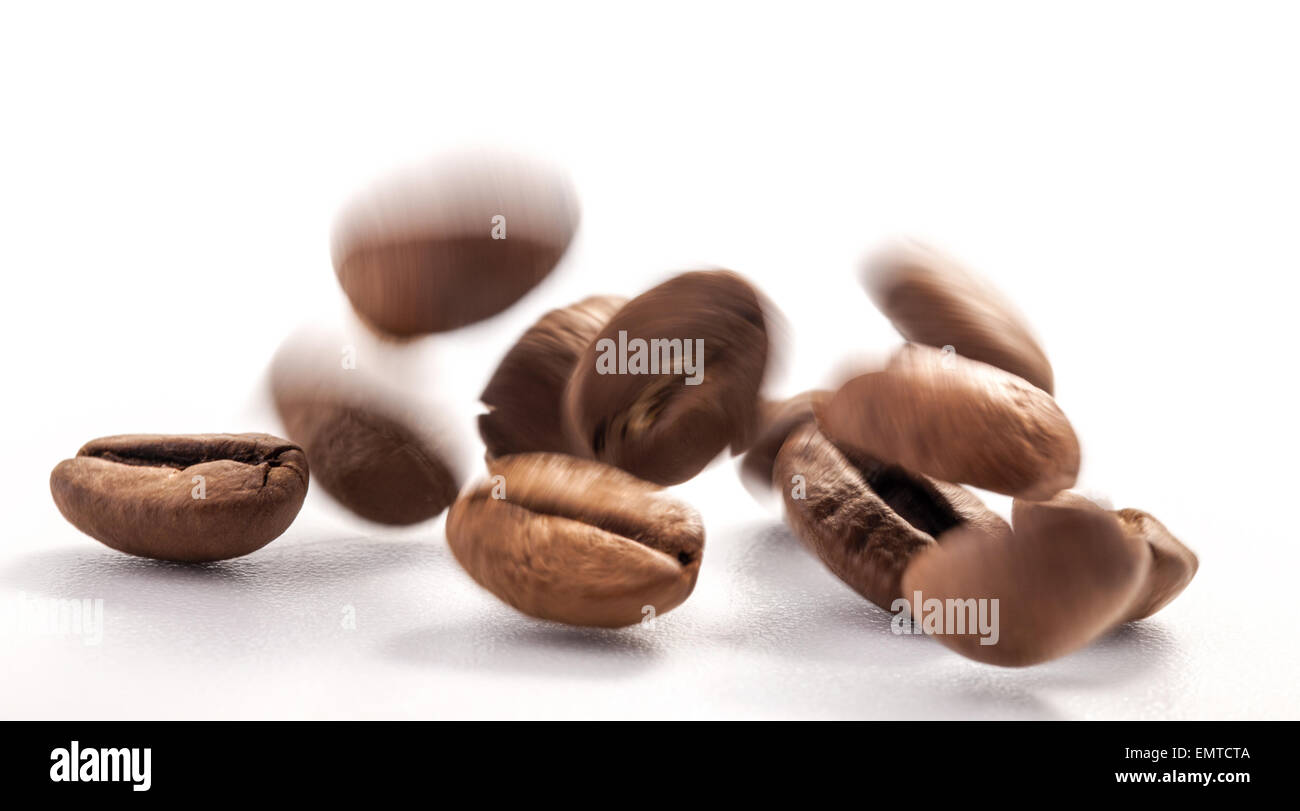Flying coffee beans isolated on white background Stock Photo - Alamy