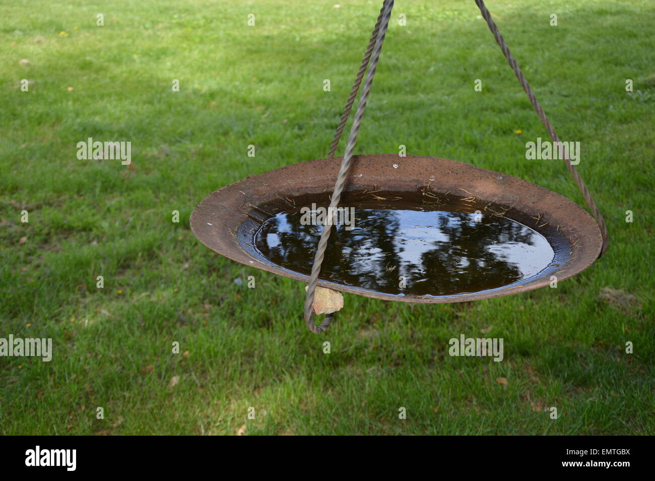 An imaginative water basin made of iron objects Stock Photo