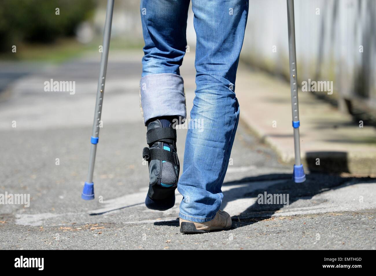 Man with crutches, Germany, city of Osterode, 15. April 2015. Photo: Frank May/picture alliance Stock Photo