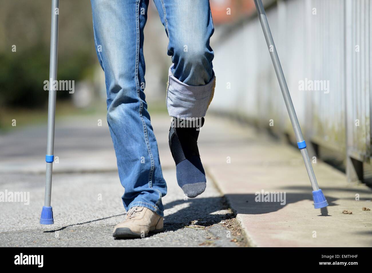 Man with crutches, Germany, city of Osterode, 15. April 2015. Photo: Frank May/picture alliance Stock Photo