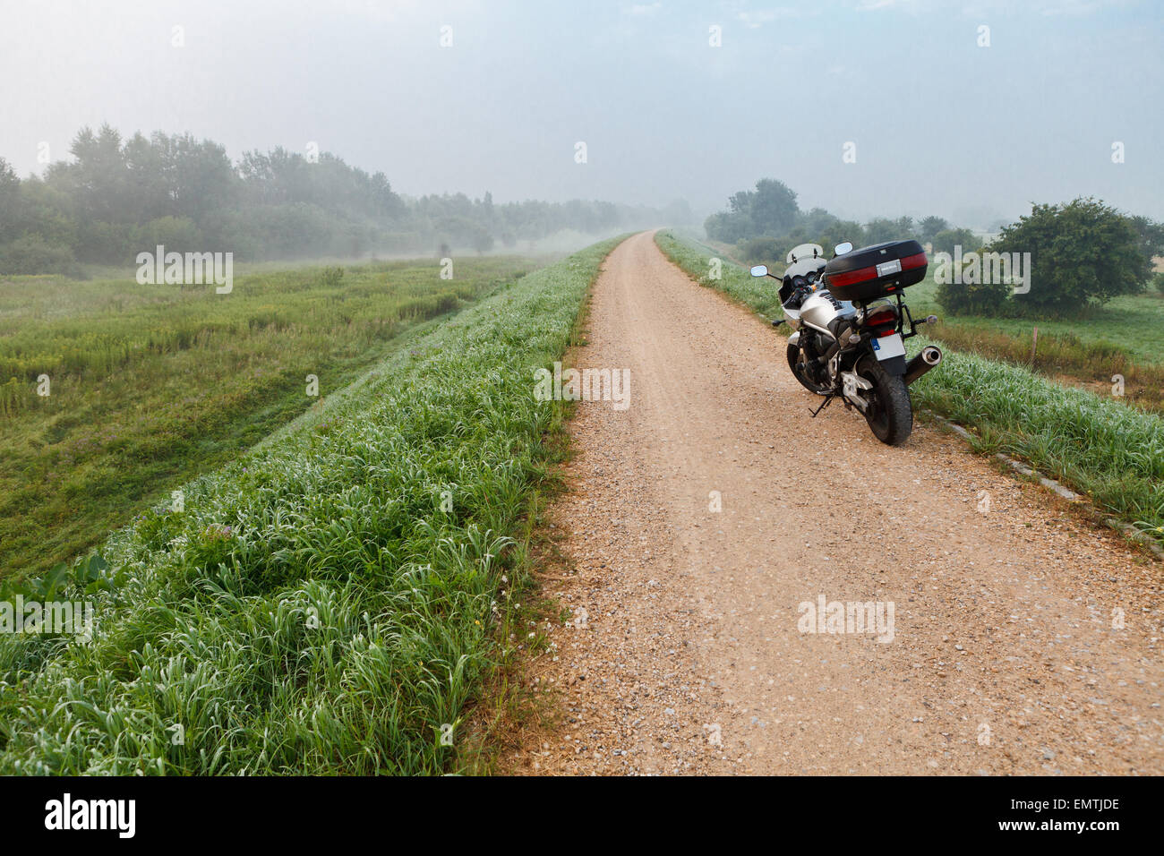Motorcycle on gravel road Stock Photo Alamy