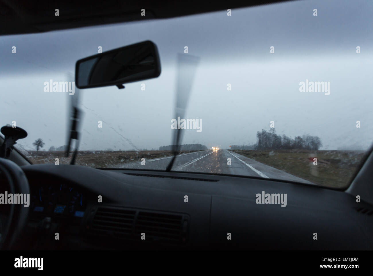 Bad weather conditions driving a car, wipers working Stock Photo
