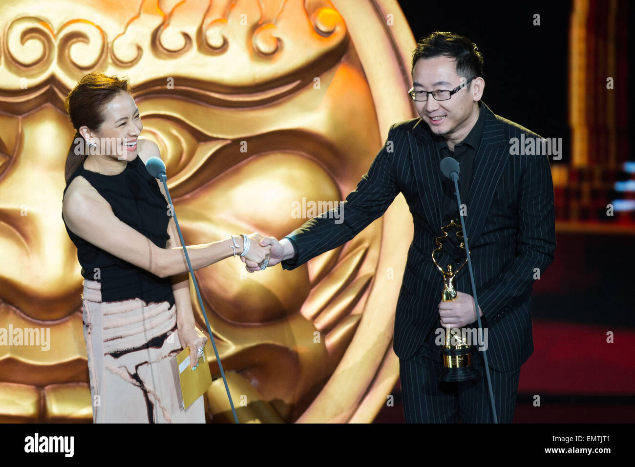Beijing, China. 23rd Apr, 2015. Guests Lu Chuan (R) and Karena Lam attend the awarding ceremony of the Tiantan Award of the fifth Beijing International Film Festival (BJIFF) in Beijing, capital of China, April 23, 2015. © Chen Jianli/Xinhua/Alamy Live News Stock Photo