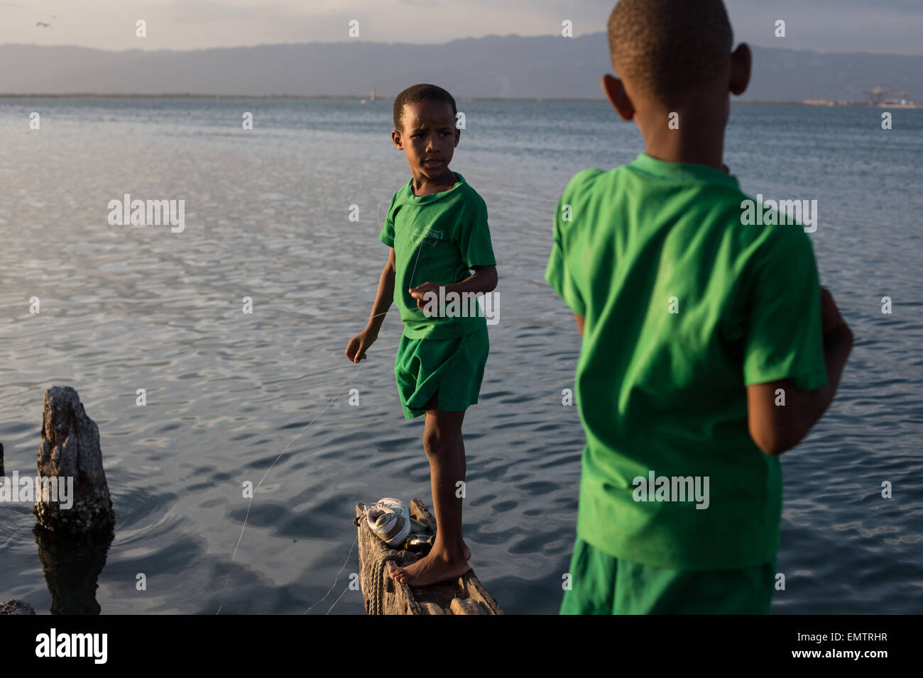 fishing at dusk in Port Royal, in Kingston Harbour, Jamaica, in the West Indies, Caribbean. Stock Photo