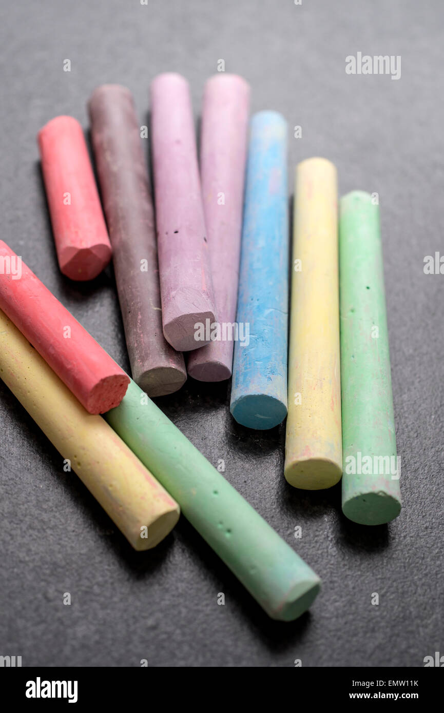Colored chalk on a blackboard background,close up Stock Photo