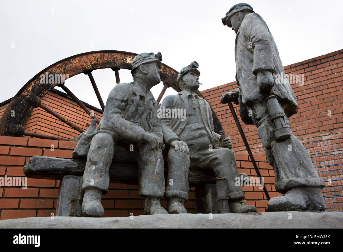 UK, Cumbria, Flimby, three miners sculpture outside former colliery, by
