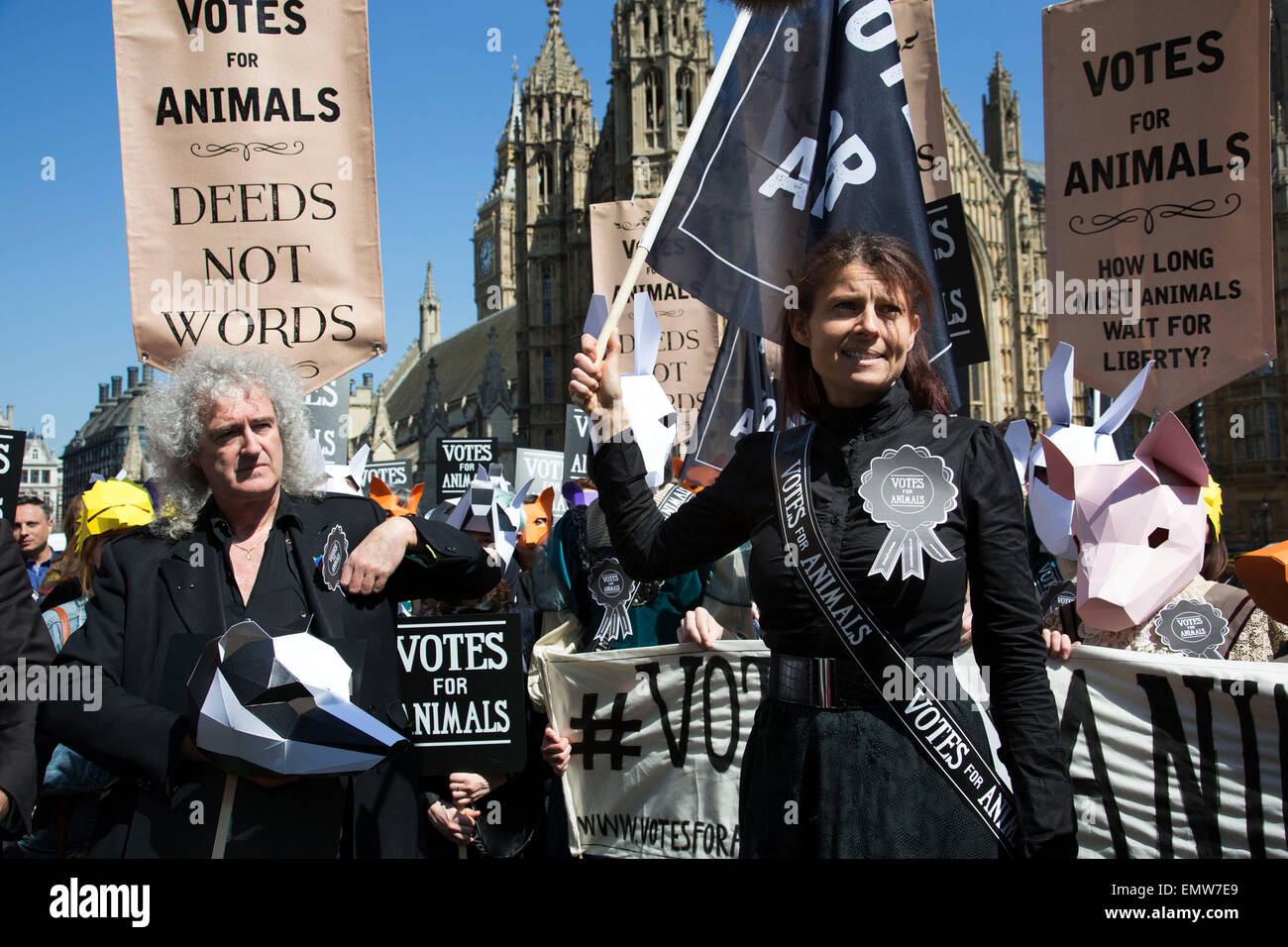 London, UK, 23rd April 2015. Campaigners speak as Brian May looks on at an animal welfare General Election drive. A day of action including a march on Parliament marks the launch of the ‘Votes for Animals’ campaign to highlight the importance of animal welfare issues in the General Election.  The aim of the campaign is to help inform the public on where their local candidates stand on the issue of animal welfare and to take this into consideration when voting. Credit:  Michael Kemp/Alamy Live News Stock Photo