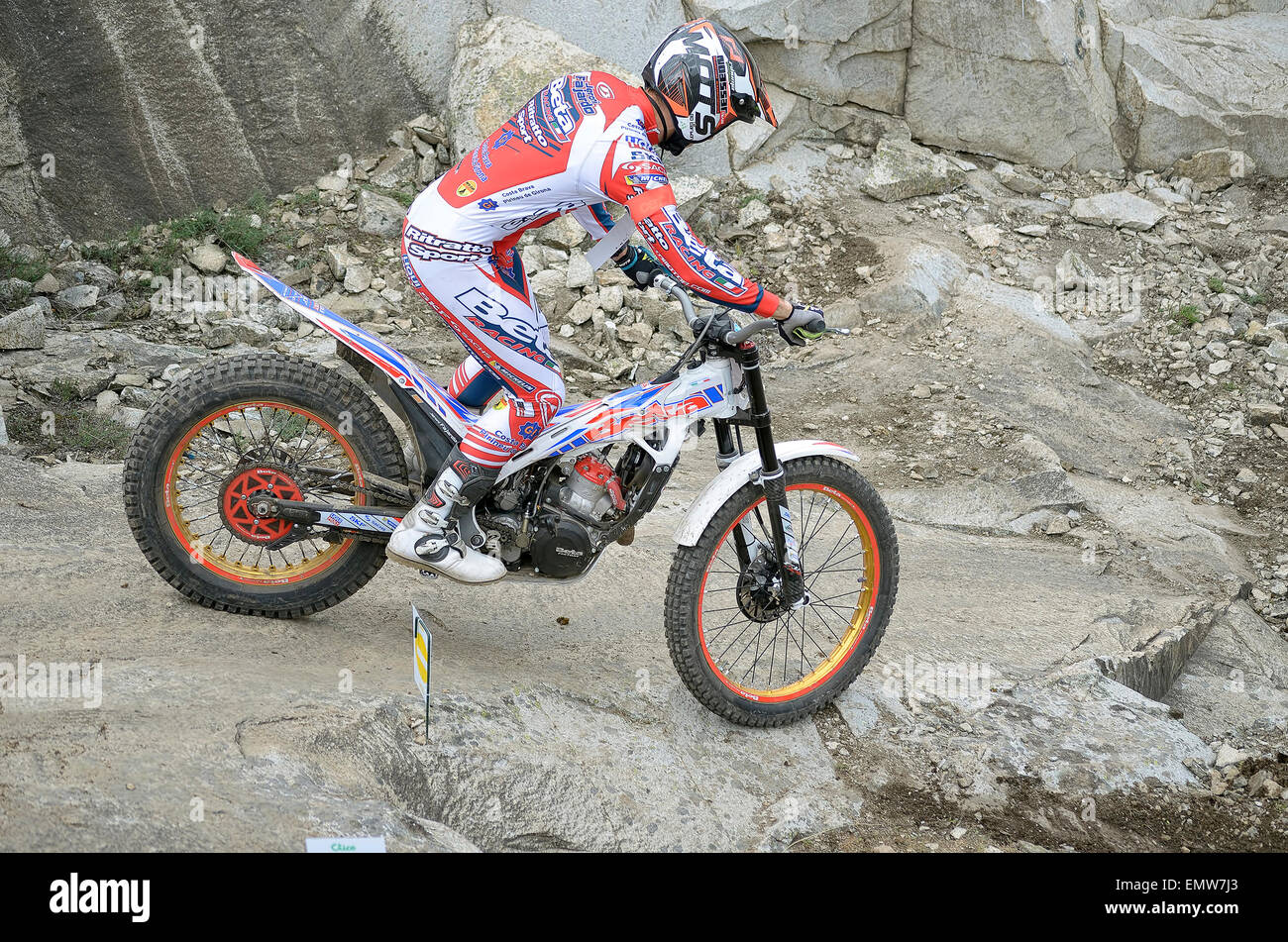 Spain trial championship. Jeroni Fajardo drives his motorcycle over granite rocks. He finished in 2nd position (TR1). Stock Photo