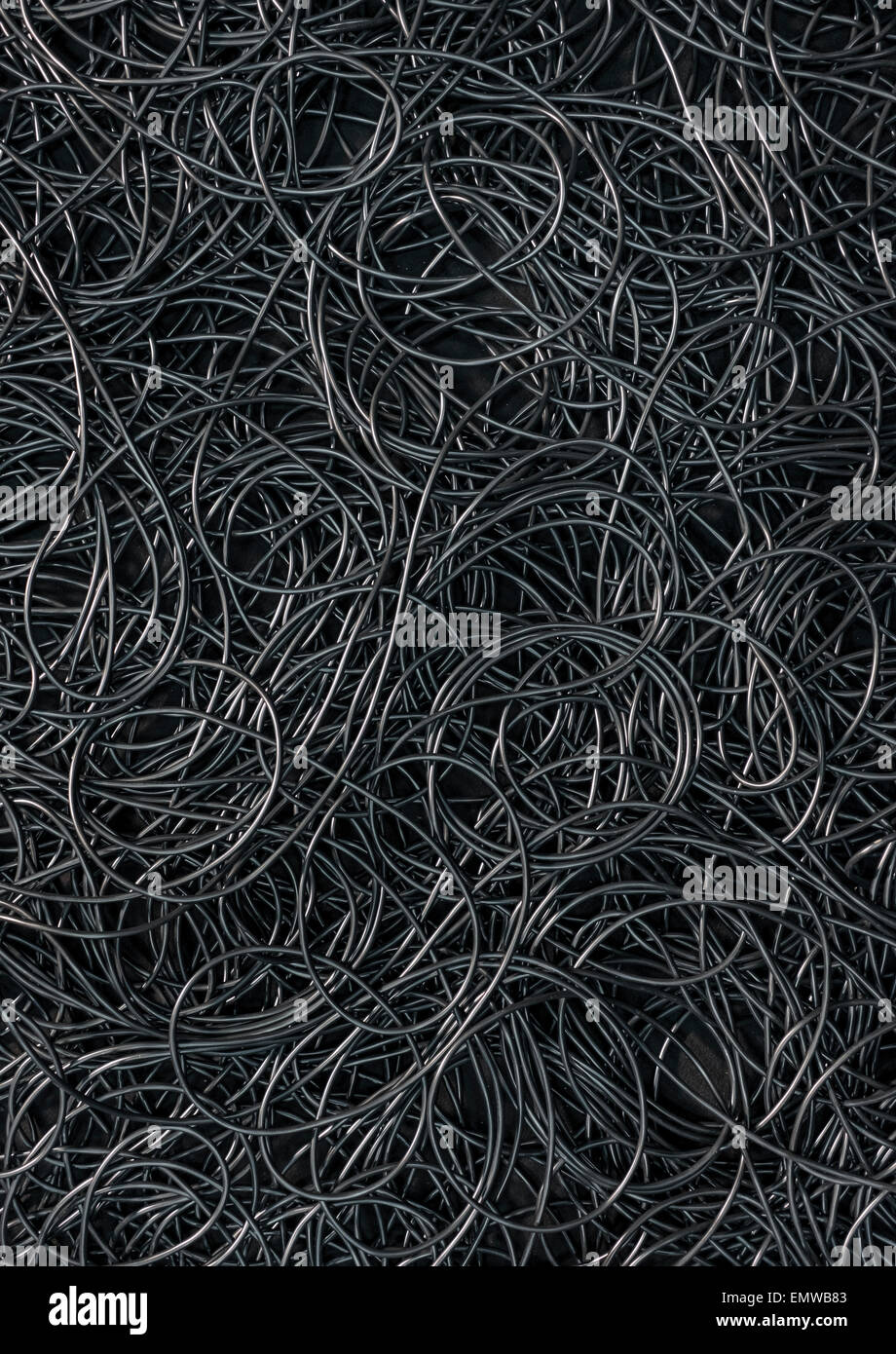 Background covered with a pile of electric cords filling the entire frame Stock Photo