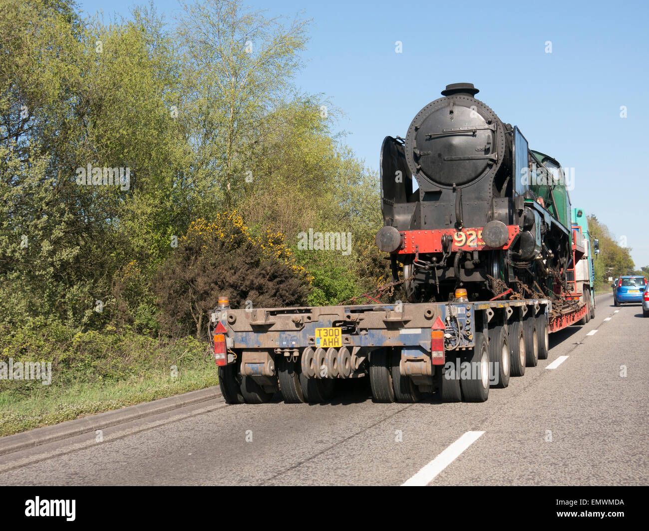 Locomotive steam train being transported by road 2015 Stock Photo
