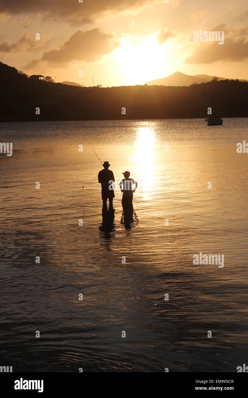 Father son silhouette fishing sunset hi-res stock photography and ...