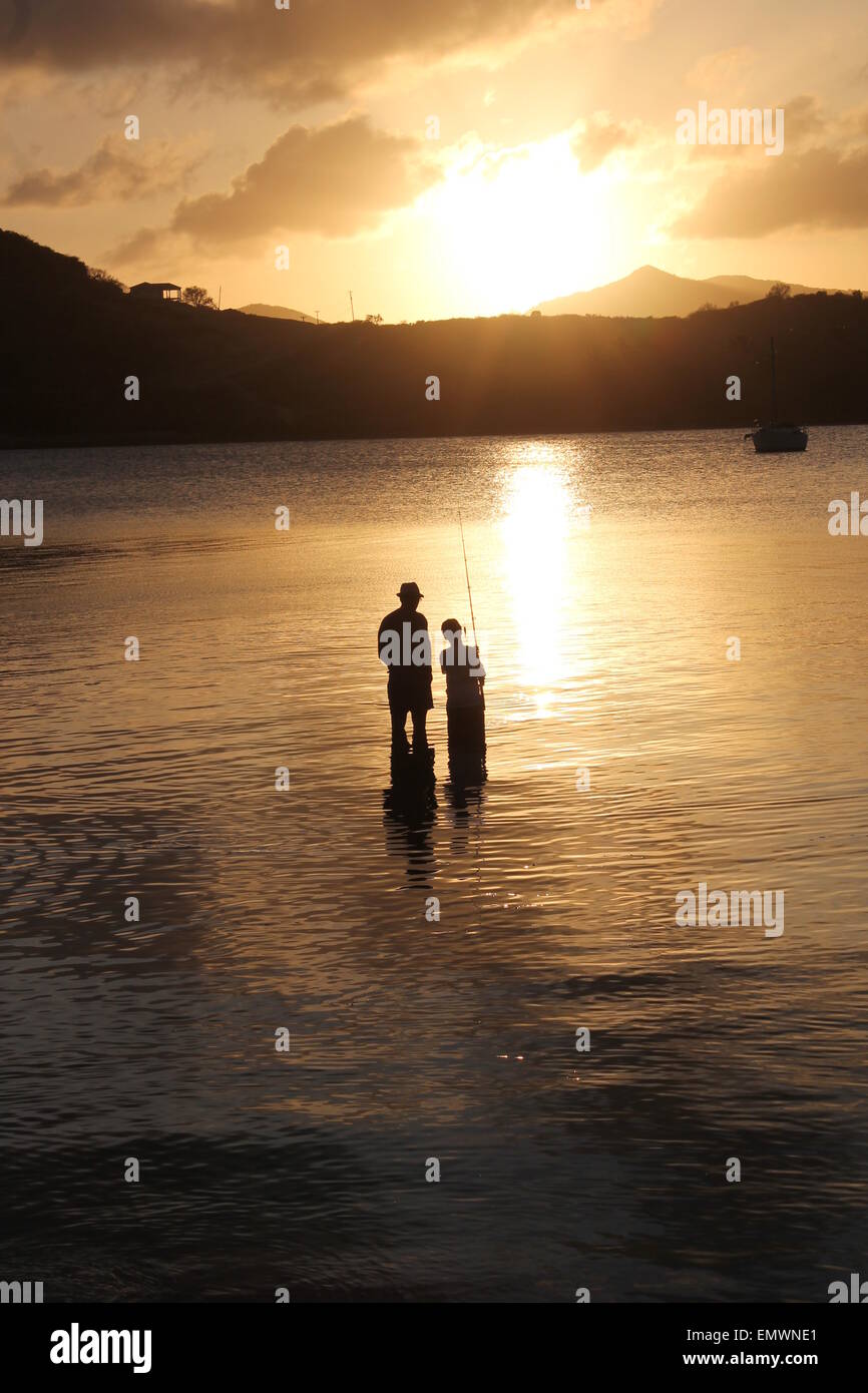 Father son silhouette fishing sunset hi-res stock photography and ...