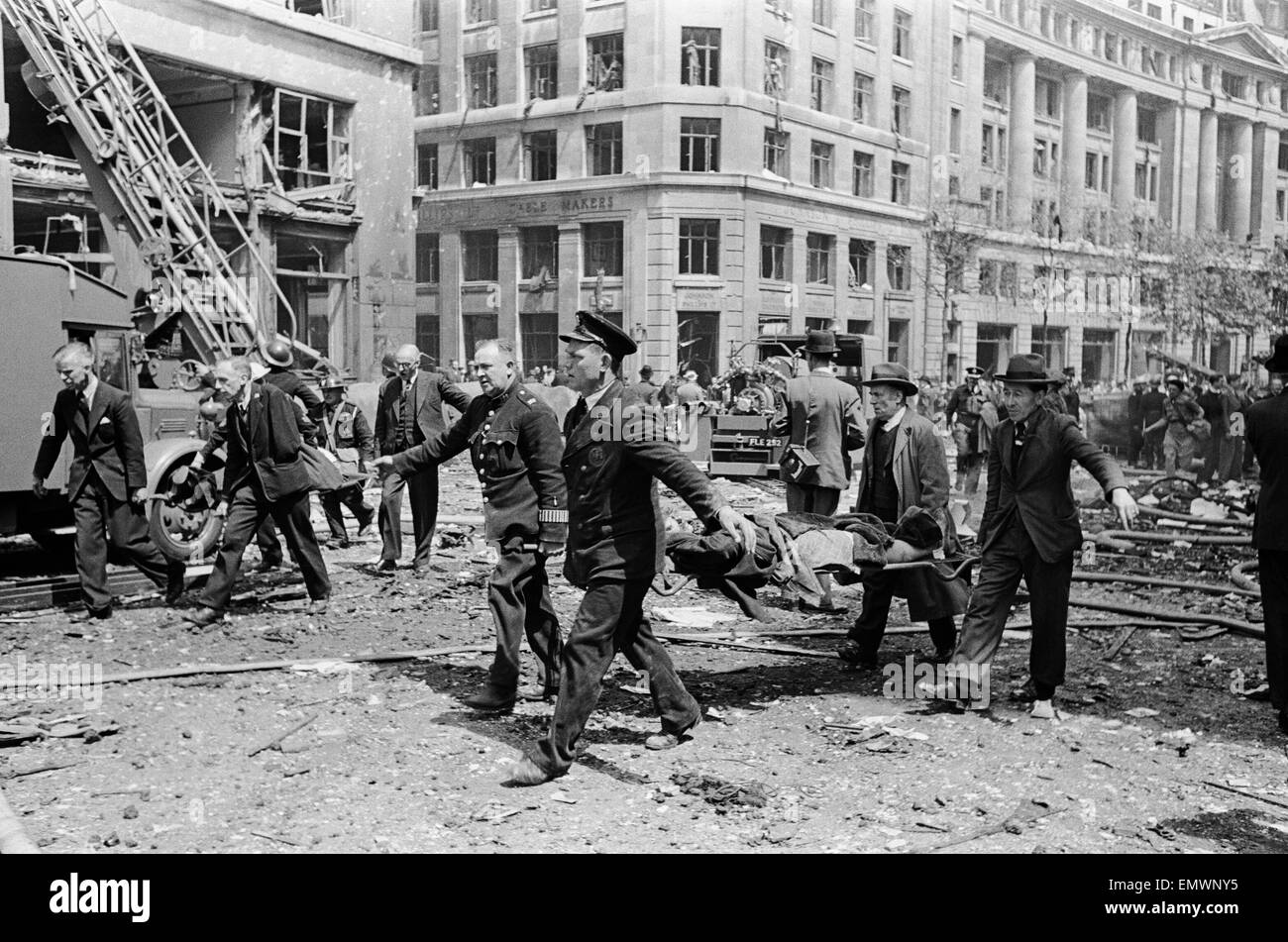 Rescue of casualties by N.F.S and C.D on Buxton and Underwood St, E1, after a hit by a V1 Flying bomb. 1st August 1944. Stock Photo