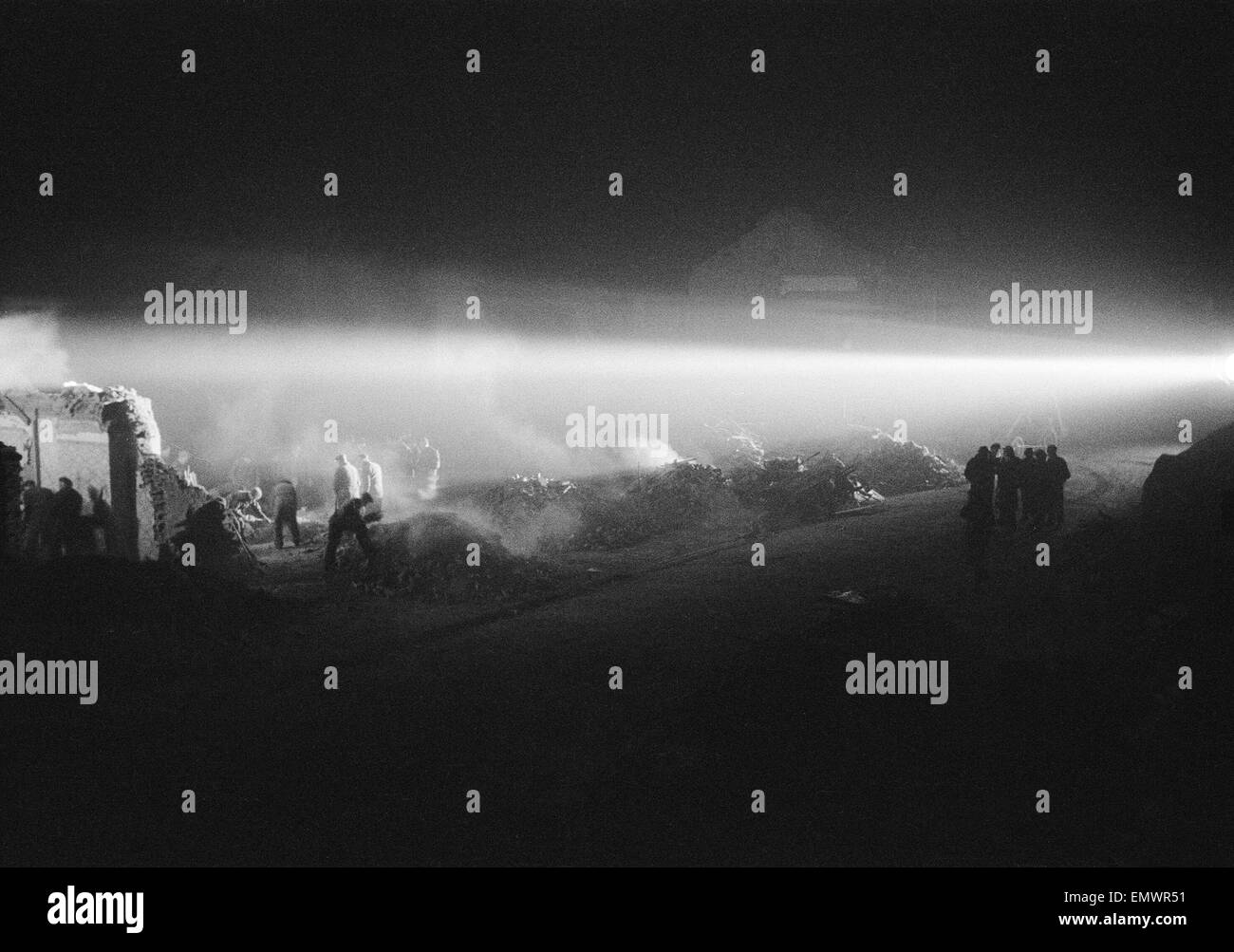 Rescue of two missing persons with searchlights on Fairfax Road, N8, London. 11th December 1944. Stock Photo