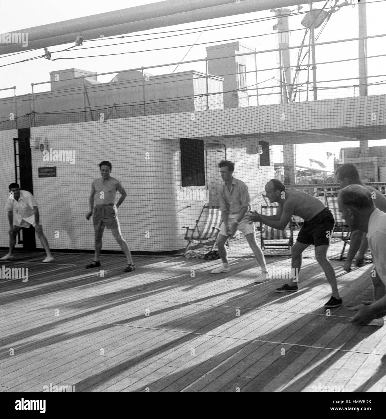 English cricket team in Australia in 1958/59. Captain Peter May and his team practicing on the deck of the 'Iberia' en-route to Australia. October 1958 Stock Photo