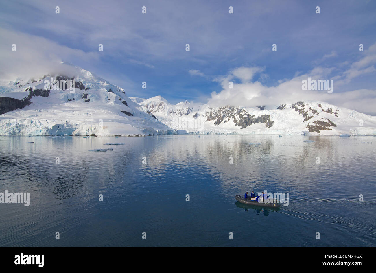 Snowcapped mountains and zodiac Paradise Bay Antarctic Peninsular Antarctica Stock Photo