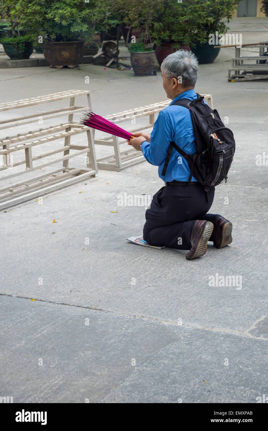Man prays on his knees hi-res stock photography and images - Alamy