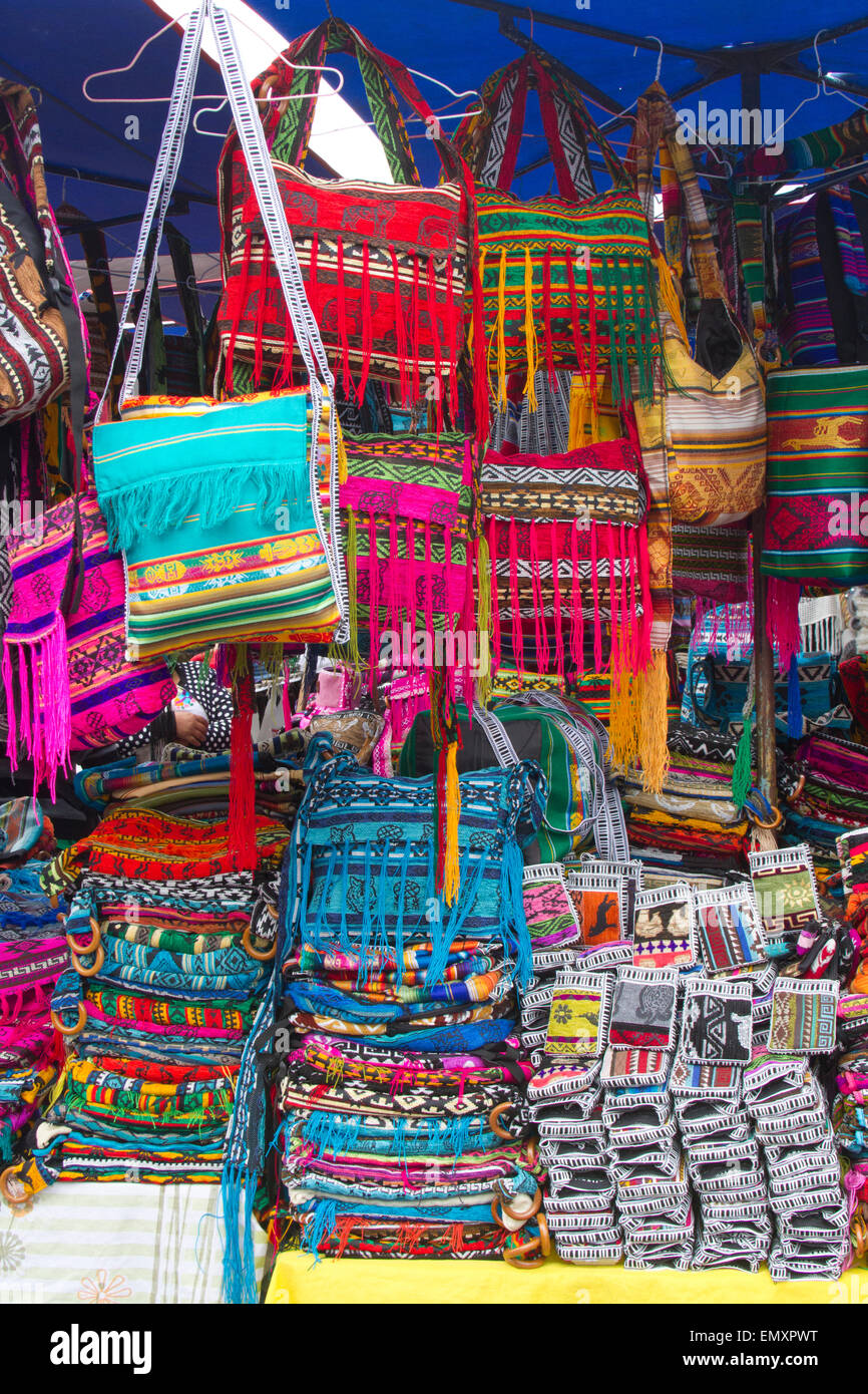 Brightly colored fabrics on display for sale at Otavalo market Stock Photo  - Alamy