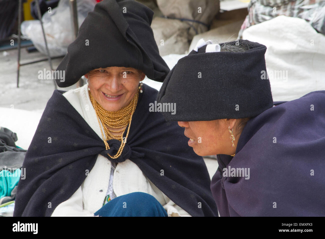 Two female vendors having conversation at Otavalo market, Ecuador Stock Photo