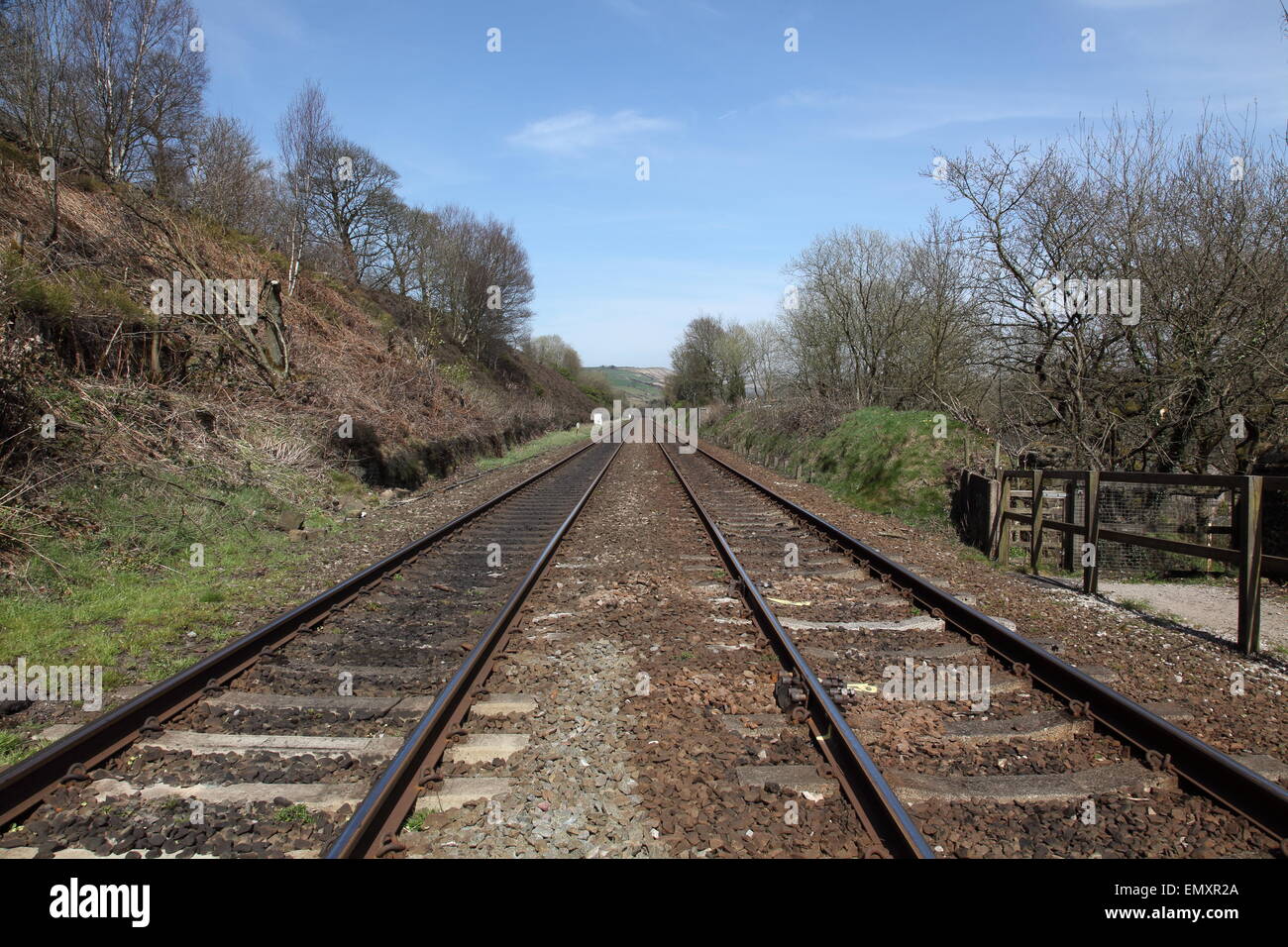 The Manchester-Huddersfield dual train track passes close to Uppermill in Saddleworth as it disappears eastwards towards the Pen Stock Photo