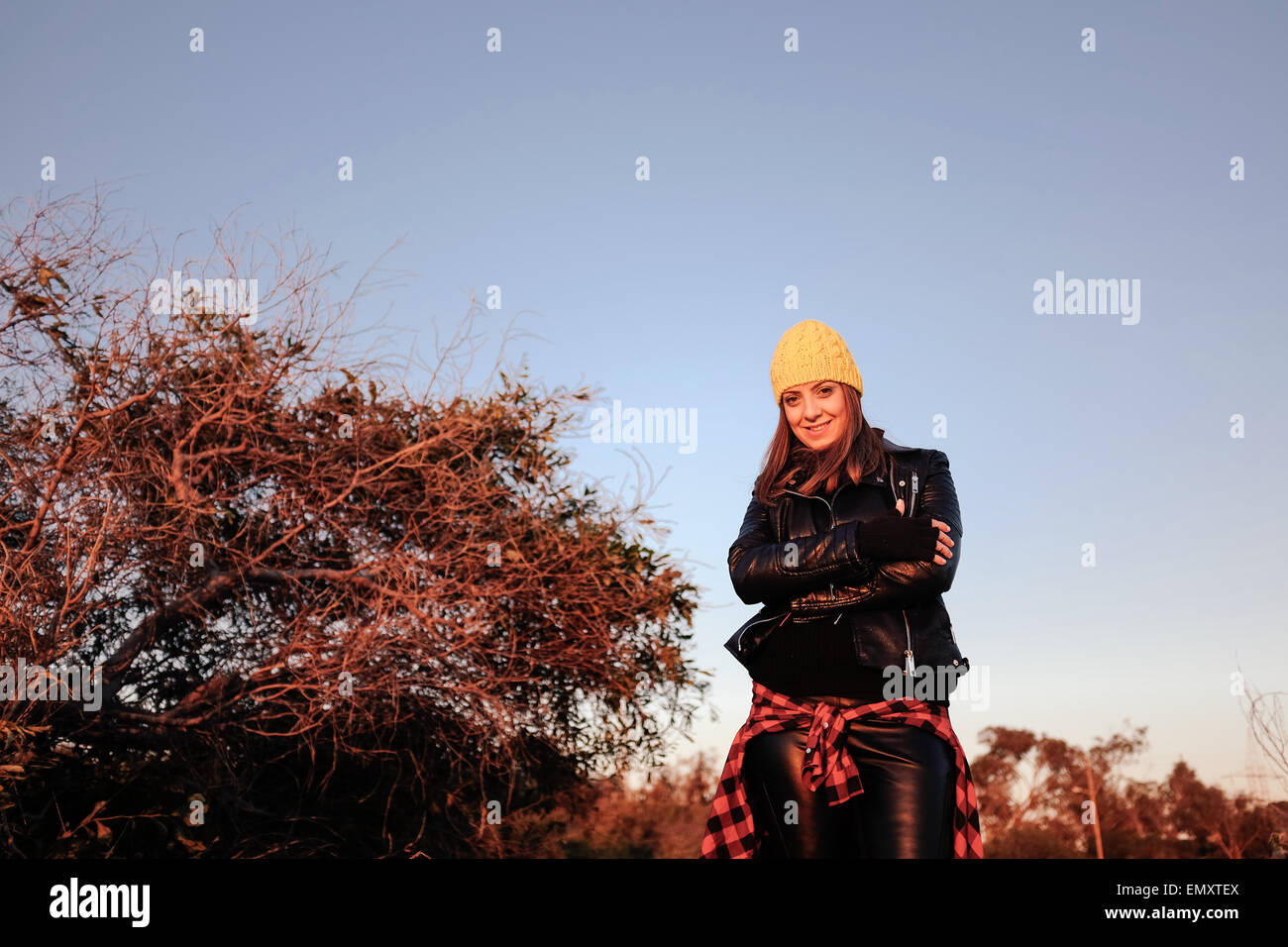 Young woman with yellow skull cap outdoor vintage outfit Stock Photo