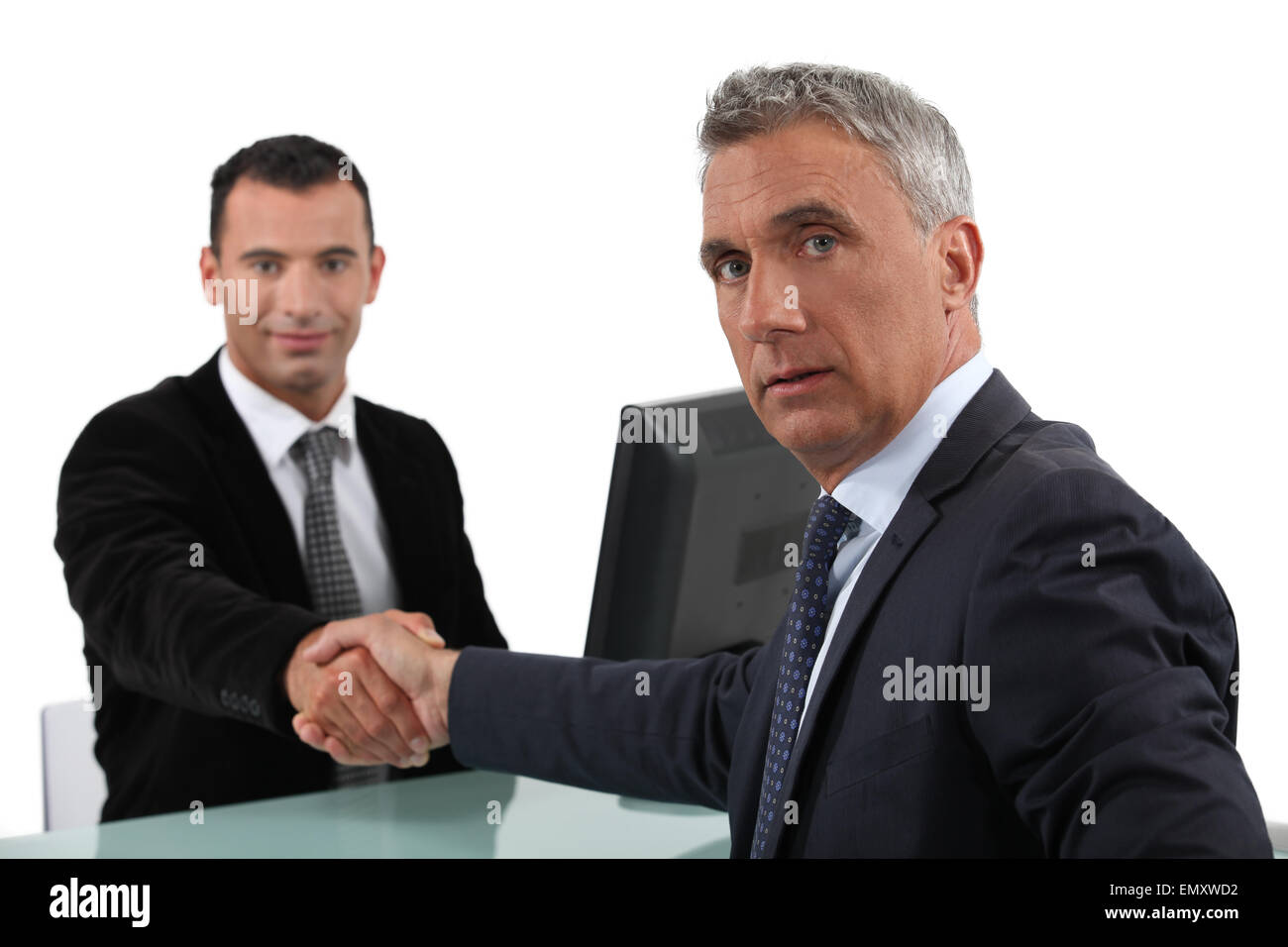 Businessmen sealing deal Stock Photo Alamy