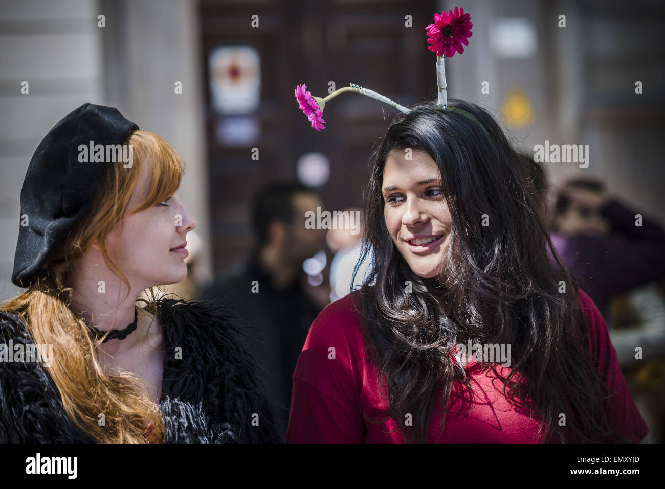 April 23, 2015 - Two young girls with flowers in the hair run one of the countless stands of roses on St Jordi in Barcelona © Matthias Oesterle/ZUMA Wire/ZUMAPRESS.com/Alamy Live News Stock Photo